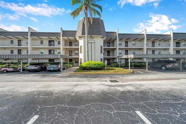 8765 Bardmoor Blvd Unit 107, Seminole, FL 33777 - view of building exterior featuring covered and uncovered parking