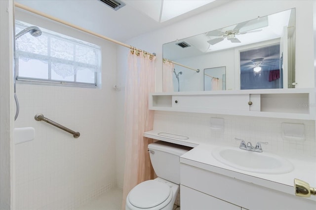 4235 Tamargo Dr Unit 4235, New Port Richey, FL 34652 - bathroom featuring vanity, visible vents, toilet, a shower with shower curtain, and backsplash