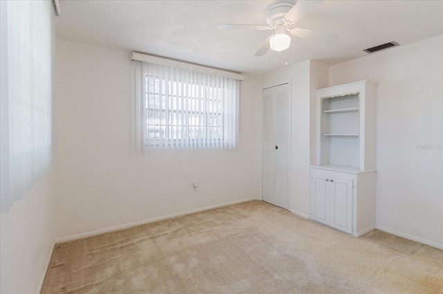 4235 Tamargo Dr Unit 4235, New Port Richey, FL 34652 - unfurnished bedroom with light carpet, a closet, baseboards, and visible vents
