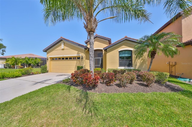 336 Silver Falls Dr, Apollo Beach, FL 33572 - view of front of property with a front yard, driveway, stucco siding, and an attached garage