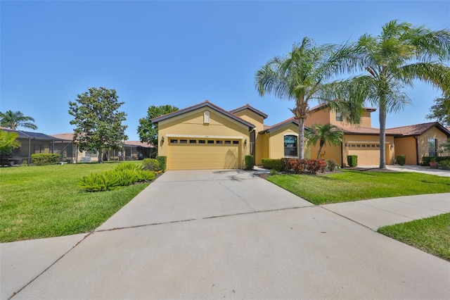 336 Silver Falls Dr, Apollo Beach, FL 33572 - view of front of property featuring concrete driveway, a front yard, stucco siding, and a garage