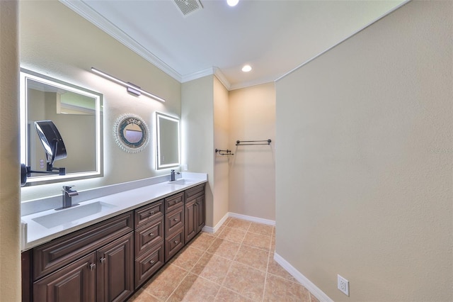 336 Silver Falls Dr, Apollo Beach, FL 33572 - bathroom featuring crown molding, visible vents, double vanity, and a sink