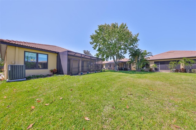 336 Silver Falls Dr, Apollo Beach, FL 33572 - view of yard with central air condition unit and glass enclosure