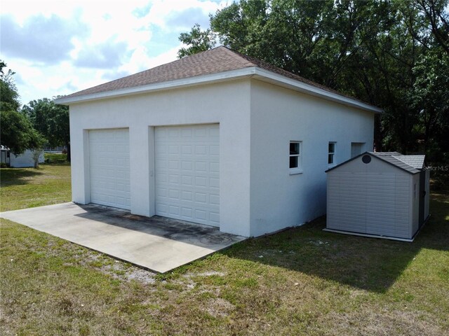 9304 Nile Dr, New Port Richey, FL 34655 - detached garage with a storage unit