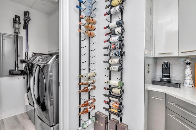 wine area featuring washing machine and dryer