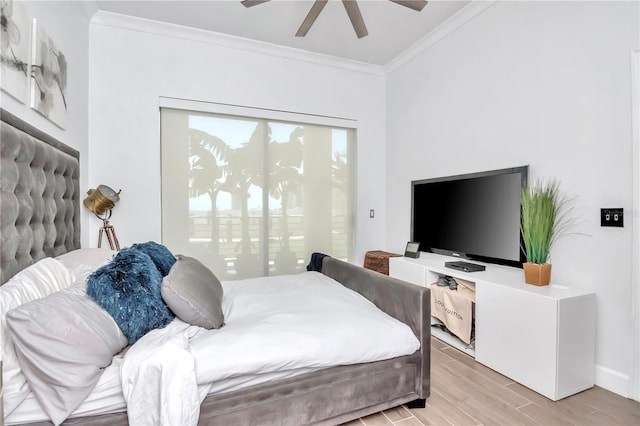 bedroom with baseboards, ornamental molding, ceiling fan, and light wood-style floors
