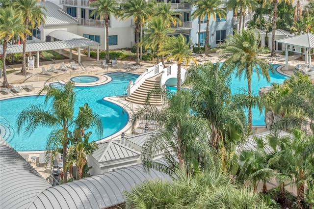 pool featuring a gazebo, a community hot tub, and a patio area