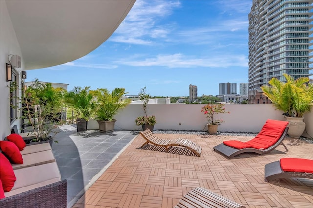 view of patio / terrace with fence and a city view