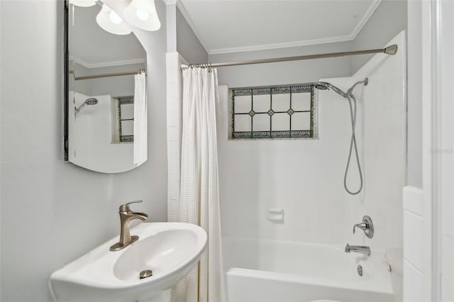full bathroom with shower / bath combo, a sink, and crown molding