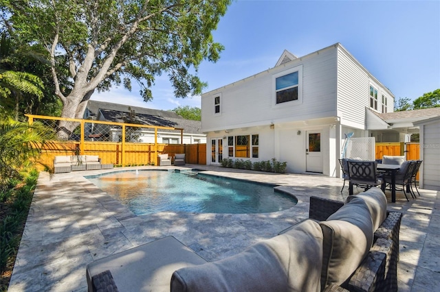 view of pool with a fenced backyard, a fenced in pool, a patio, and an outdoor hangout area