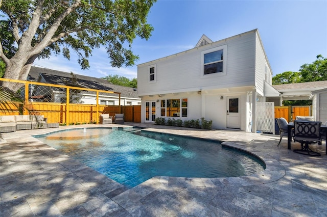 view of pool with a patio area, fence, and a fenced in pool