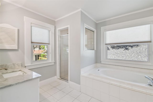 bathroom featuring a garden tub, ornamental molding, a stall shower, baseboards, and tile patterned floors