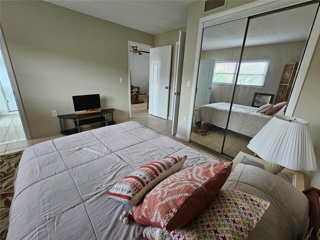 13813 Mission Oaks Blvd, Seminole, FL 33776 - bedroom featuring tile patterned flooring, visible vents, and a closet