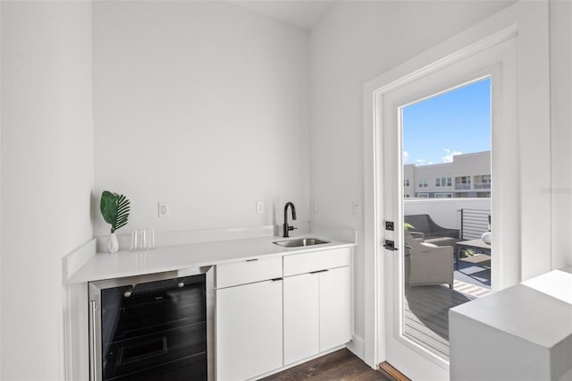 883 6th Ave S, Saint Petersburg, FL 33701 - bar featuring beverage cooler, a sink, and dark wood finished floors