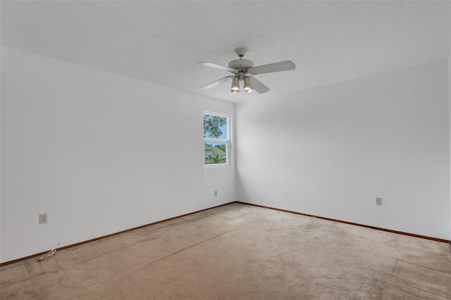 5207 Moeller Ave, Sarasota, FL 34233 - carpeted empty room featuring a textured ceiling, ceiling fan, and baseboards