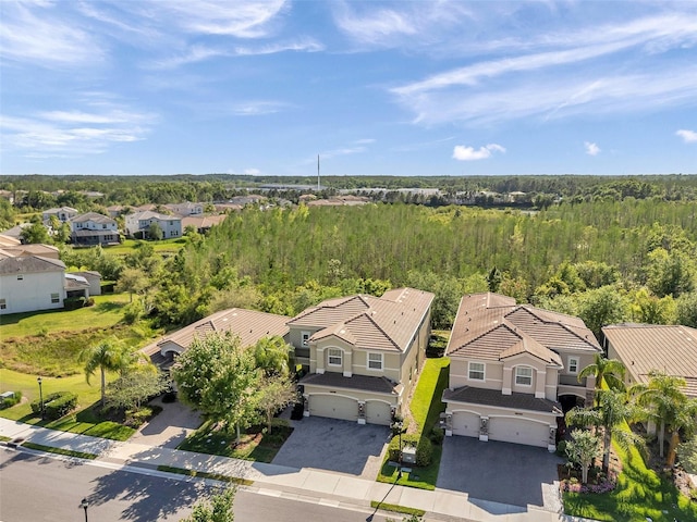 aerial view with a wooded view and a residential view