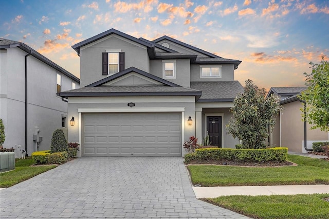 19926 Stone Pine Cir, Lutz, FL 33558 - traditional-style house with decorative driveway, stucco siding, a yard, and a shingled roof