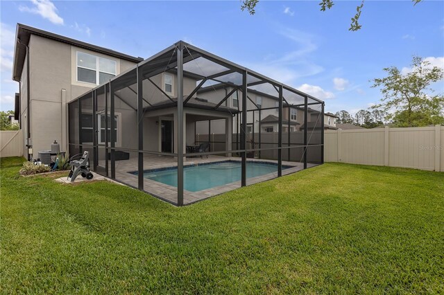 19926 Stone Pine Cir, Lutz, FL 33558 - back of house featuring stucco siding, a patio, and glass enclosure
