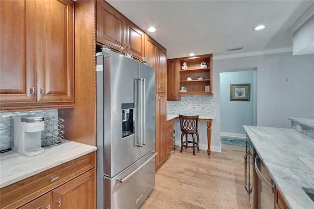 kitchen with light wood-style flooring, open shelves, brown cabinets, decorative backsplash, and appliances with stainless steel finishes
