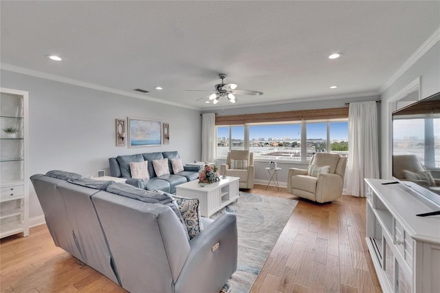 living area featuring visible vents, ceiling fan, crown molding, recessed lighting, and light wood-style flooring