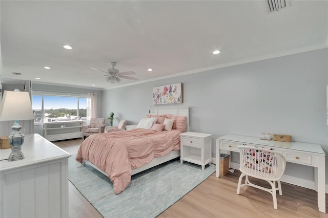 bedroom with recessed lighting, light wood-style floors, visible vents, and ornamental molding