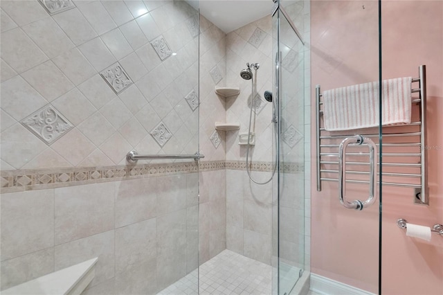full bath featuring a shower stall and radiator heating unit