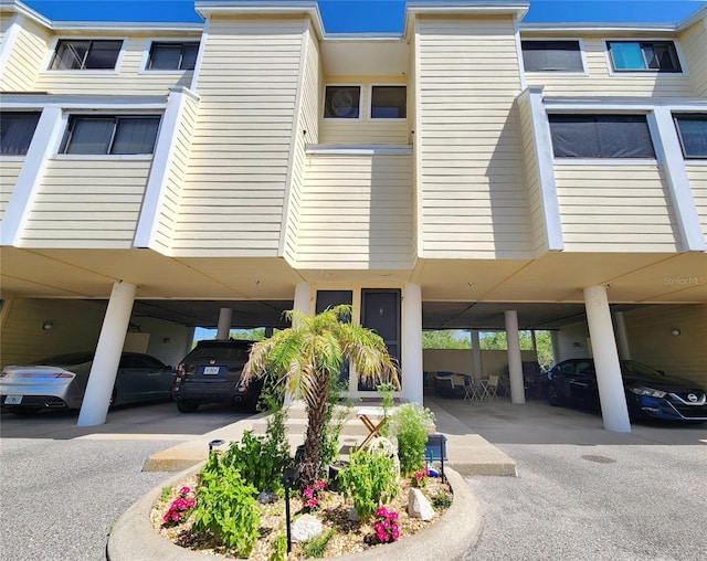 1500 Sunset Rd Unit C7, Tarpon Springs, FL 34689 - view of property with covered parking