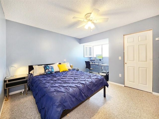 1500 Sunset Rd Unit C7, Tarpon Springs, FL 34689 - bedroom featuring carpet floors, a textured ceiling, a ceiling fan, and baseboards