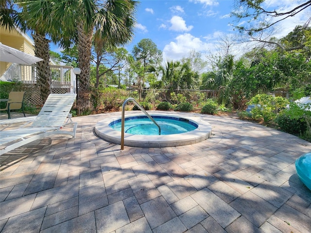 1500 Sunset Rd Unit C7, Tarpon Springs, FL 34689 - view of swimming pool with an in-ground hot tub and a patio