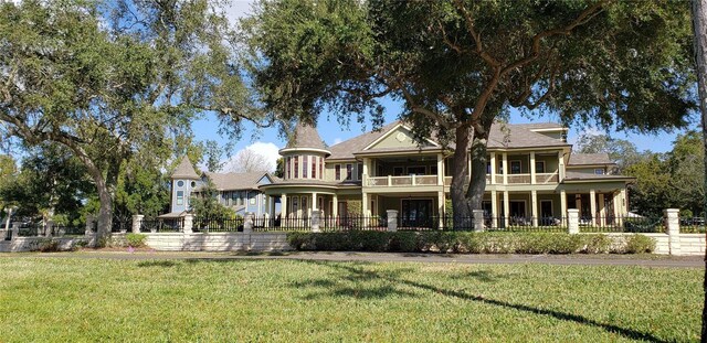 1500 Sunset Rd Unit C7, Tarpon Springs, FL 34689 - rear view of house featuring a balcony