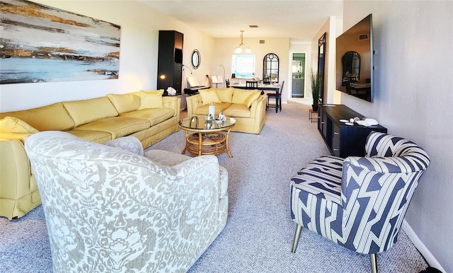 1500 Sunset Rd Unit C7, Tarpon Springs, FL 34689 - carpeted living room featuring baseboards