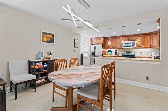 220 Belleview Blvd Unit 104, Belleair, FL 33756 - dining area with light tile patterned floors and recessed lighting