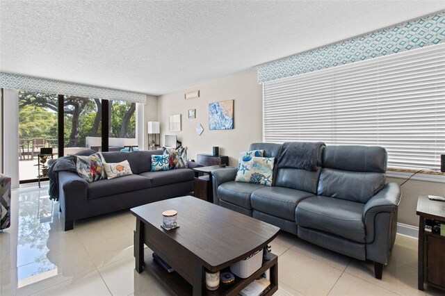 220 Belleview Blvd Unit 104, Belleair, FL 33756 - living area with light tile patterned floors and a textured ceiling