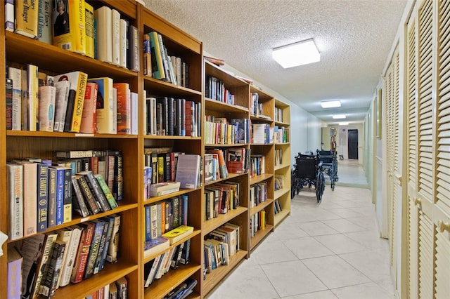 220 Belleview Blvd Unit 104, Belleair, FL 33756 - corridor with tile patterned floors and a textured ceiling