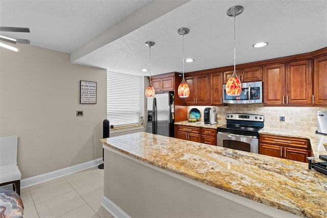 220 Belleview Blvd Unit 104, Belleair, FL 33756 - kitchen with appliances with stainless steel finishes, light stone countertops, backsplash, light tile patterned flooring, and brown cabinets