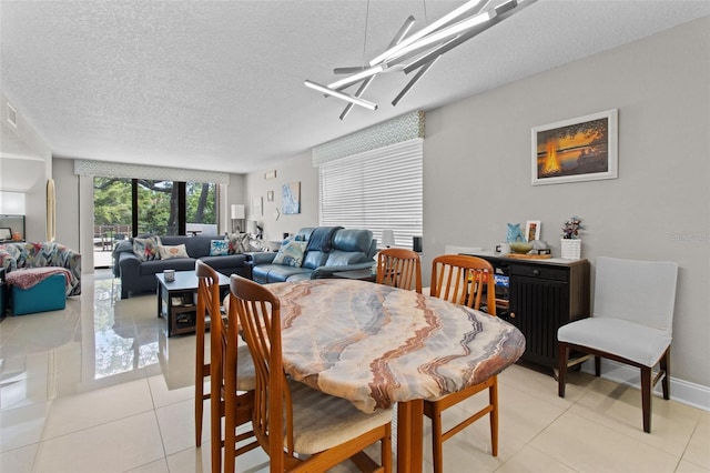 220 Belleview Blvd Unit 104, Belleair, FL 33756 - dining area featuring a textured ceiling and light tile patterned flooring