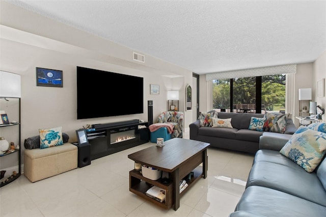 220 Belleview Blvd Unit 104, Belleair, FL 33756 - living area with light tile patterned flooring and a textured ceiling