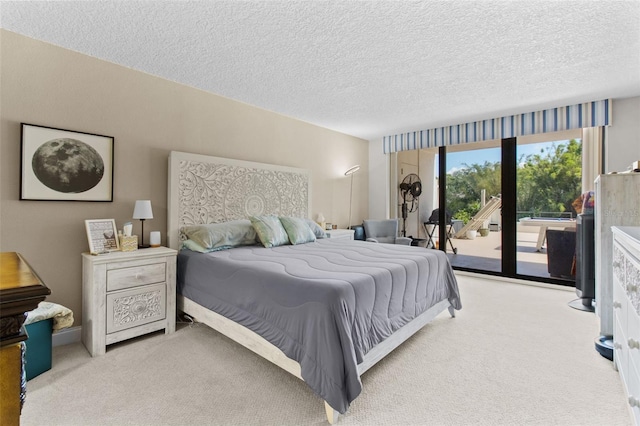 220 Belleview Blvd Unit 104, Belleair, FL 33756 - bedroom with carpet flooring, access to outside, and a textured ceiling