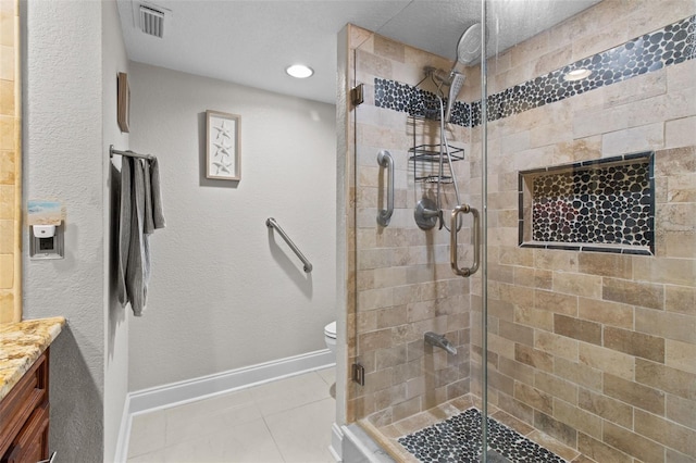 220 Belleview Blvd Unit 104, Belleair, FL 33756 - full bathroom with tile patterned floors, a shower stall, and vanity
