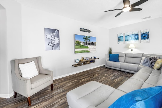 living room with visible vents, baseboards, a ceiling fan, and wood finished floors