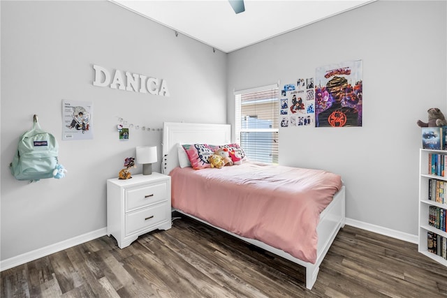 bedroom featuring baseboards, ceiling fan, and wood finished floors