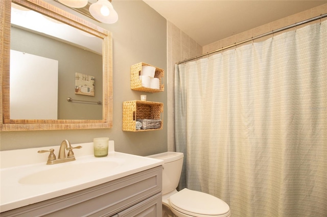 bathroom with toilet and vanity