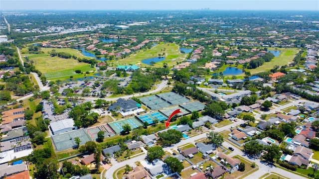 bird's eye view featuring a water view and a residential view