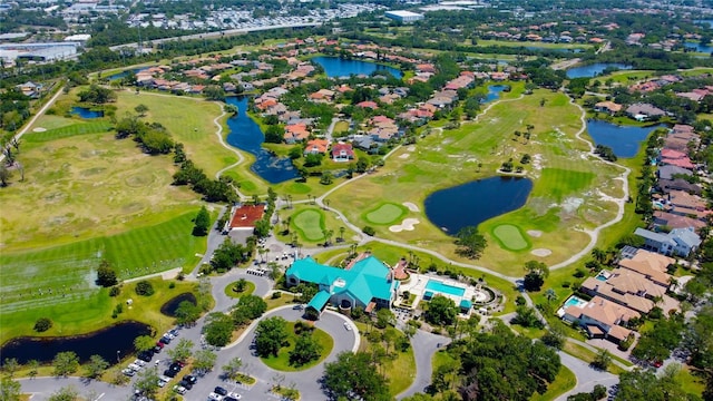 bird's eye view with a water view, golf course view, and a residential view