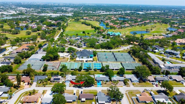 drone / aerial view featuring a water view and a residential view