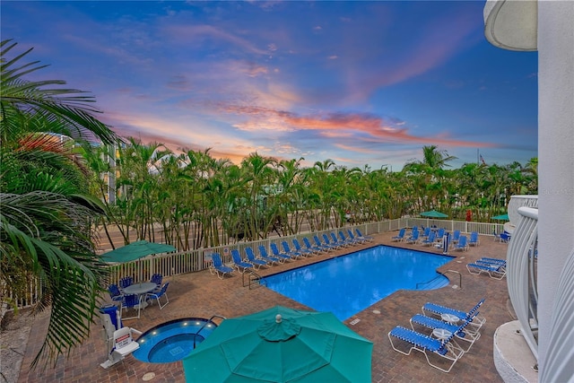 11605 Gulf Blvd Unit 203, Treasure Island, FL 33706 - community pool with a hot tub and a patio area