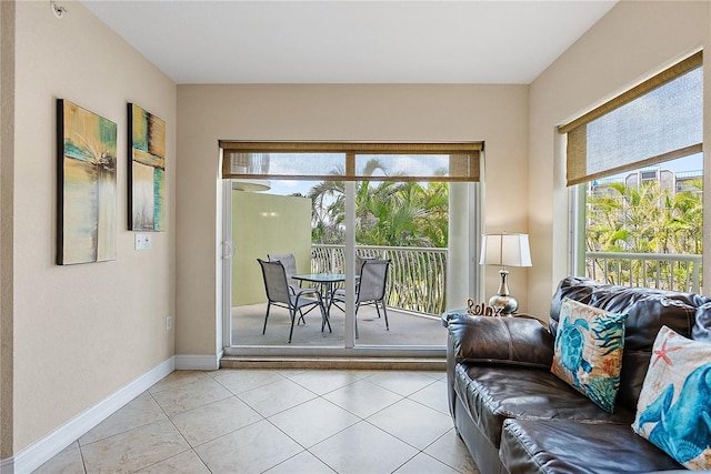 11605 Gulf Blvd Unit 203, Treasure Island, FL 33706 - living area with light tile patterned flooring and baseboards