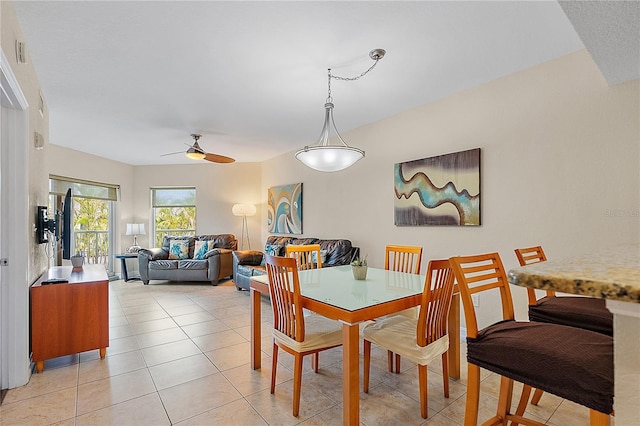 11605 Gulf Blvd Unit 203, Treasure Island, FL 33706 - dining room featuring ceiling fan and light tile patterned flooring