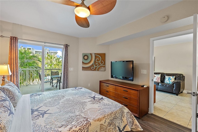11605 Gulf Blvd Unit 203, Treasure Island, FL 33706 - bedroom featuring access to outside, a ceiling fan, and wood finished floors