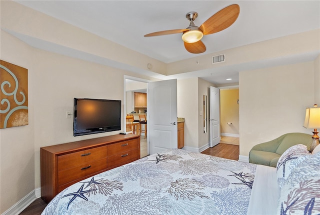 11605 Gulf Blvd Unit 203, Treasure Island, FL 33706 - bedroom featuring wood finished floors, baseboards, and ceiling fan